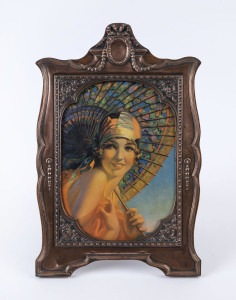 A fine repoussé copper picture frame with Art Deco portrait, early 20th century, ​ 37 x 24cm