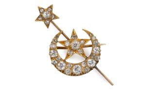 An antique 15ct gold moon and stars bar brooch set with 31 diamonds, late 19th early 20th century, ​5cm wide, 10.5 grams