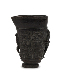 A Chinese libation cup, carved horn, Qing Dynasty, 19th century or earlier, 15cm high