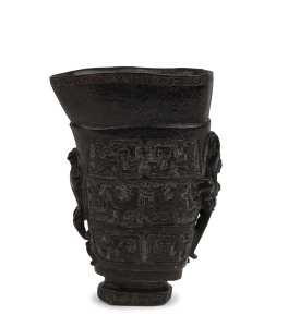 A Chinese libation cup, carved horn, Qing Dynasty, 19th century or earlier, ​15cm high