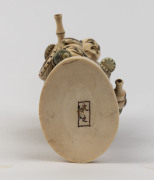 A Japanese statue of the basket seller, carved ivory, Meiji period, 19th century, two character mark to base, 20cm high, ​ - 2