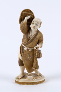 A Japanese statue of a fisherman, carved ivory, Meiji period, 19th century, red seal mark to base, 12.5cm high, 