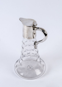 An English claret jug, etched glass with sterling silver top, London, circa 1896, ​26cm high