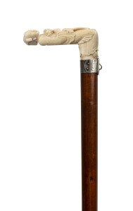 A Chinese carved ivory handled walking stick with silver collar engraved "LOWE", Malacca cane shaft and brass ferrule, 19th century, 87cm high