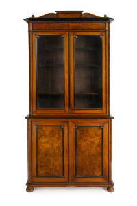 An antique bookcase, walnut with ebonized trim, 19th century, 239cm high, 115cm wide, 50cm deep