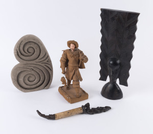 Dyak pipe, African carving, Maori pumice carving and a Japanese folk art statue, 20th century, (4 items), ​the largest 40cm high