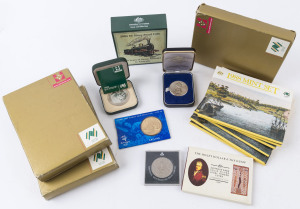 Coins - Australia: 1970-2000s small accumulation with 1988 First Fleet uncirculated coin sets (6, retail $120), 1988 First Fleet proof set (3, retail $150), 1978 Bicentenary silver proof, 1988 Holey Dollar & Dump silver coins, 2004 Steam Railways $5 silver proof, 1970 Cook Bicentenary silver medallion, plus two other items; all in original packaging, total retail $450+. (15 items)