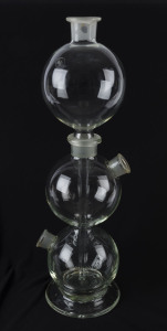 A Bohemian glass triple distillery bottle, circa 1920s, acid etched circular mark "Czechoslovakia", 57cm high