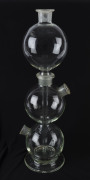 A Bohemian glass triple distillery bottle, circa 1920s, acid etched circular mark "Czechoslovakia", 57cm high