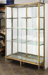 A French shop display cabinet, bronze and glass, early 20th century, 200cm high, 135cm wide, 38cm deep