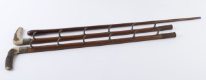 A two piece wall mount walking stick rack and one walking stick, 19th century, (3 items), the walking stick 89cm high