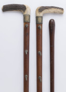 A two piece wall mount walking stick rack and one walking stick, 19th century, (3 items), the walking stick 89cm high - 2