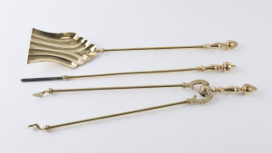 Set of three antique brass fire irons, 19th century, the shovel 66cm long