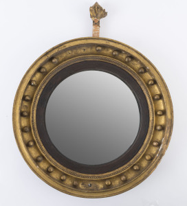 A Georgian circular convex mirror in gilt frame (missing eagle finial), early 19th century, 46cm diameter