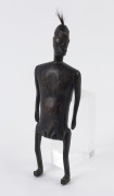 An African fertility doll, carved wood, hair and bone, 20th century, ​38cm high