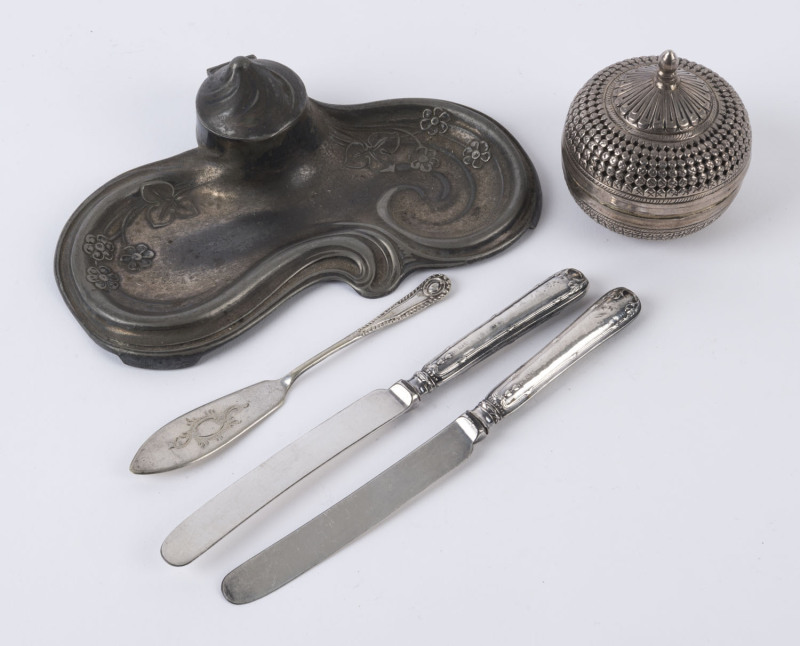 A Thai silver box, two silver handled knives, a silver plated inkwell and pâté knife, 19th and 20th century, (5 items), the inkwell 18cm wide