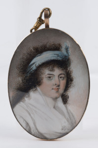 A Georgian miniature portrait of a lady in rose gold mount, reverse with braided hair display, both sides under original convex glass, late 18th century, 9.5cm high overall