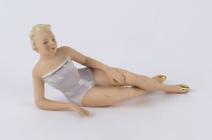 FASOLD & STAUCH Art Deco porcelain piano statue of a reclining beauty, circa 1925, 21cm long