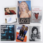 AMERICAN ROCK & POP ICONS - BOOKS AND AUTOGRAPHS: with hardbound Courtney Love "The Real Story" by Poppy Bright (1997) signed by Bright on title page plus signed colour photo (25x20mm) of Love, Gene Simmons "Sex Money Kiss" (2003) signed on title page by