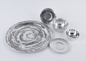 Silver finished tray, two saucers and two bowls, 20th century, the tray signed "Don Sheil", ​the tray 38cm diameter