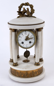 An antique French empire style mantel clock, time and strike movement in white marble case with gilt metal mounts, 19th century. case very loose requiring attention, 40cm high