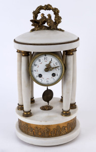 An antique French empire style mantel clock, time and strike movement in white marble case with gilt metal mounts, 19th century. case very loose requiring attention, ​40cm high