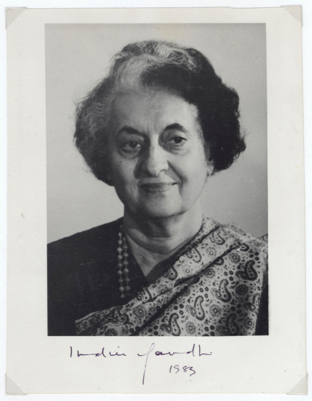 INDIRA GANDHI: autograph on black & white photograph (19.5 x 15cm) signed "Indira Gandhi 1983", another signature on 1973 Gandhi and Nehru (Indira Gandhi's father) commemorative first day cover, plus Rajiv Gandhi (Indira's son and successor) signature on