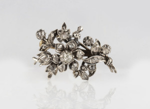 An antique diamond floral cluster brooch, silver topped with gold back, 19th century, ​4cm wide, 9.5 grams