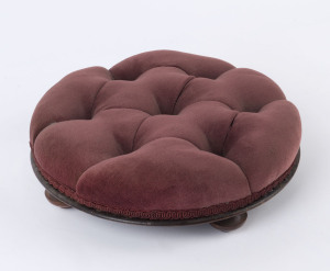 A circular footstool with plum velvet button upholstery, 19th century, 10cm high, 32cm diameter