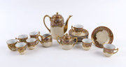 A Japanese Satsuma tea set, early 20th century, (15 items), the pot 19cm high