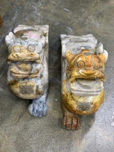 A pair of Chinese carved stone Foo dogs, 20th century, 32cm high, 62cm long