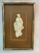 A Japanese carved ivory plaque, Meiji period, 19th century, later mount and framing, ​the carving 18cm high, frame 36 x 25cm overall