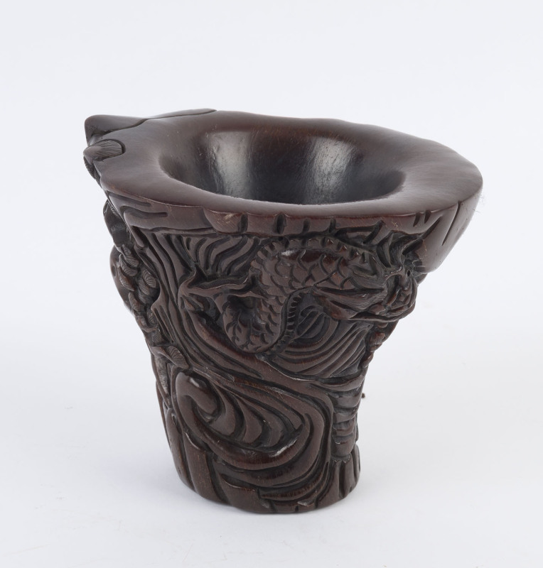 A Chinese carved horn libation cup, Kangxi mark, 19th/20th century, ​14.5cm high