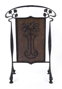 A French Art Nouveau fire screen, wrought iron and beaten copper, circa 1900, 82cm high, 56cm wide