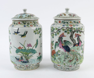 A pair of Chinese famille rose porcelain lidded vases, early 20th century, 27cm high