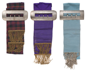 "WAXWINGS" - 1940 SOUTH AUSTRALIAN DERBY WINNER: Winner's sashes comprising 1939 Oaklands Plate (Port Adelaide) with tartan sash, 1940 Port Adelaide Guineas with violet sash, 1940 South Australian Derby (Morphettville) turquoise sash with embroidered floral horseshoe motif; all have metallic braided tassels and sterling silver buckles, the latter stamped 'C.W. Ottaway & Co, Adelaide". (total buckle weight 950gr).
