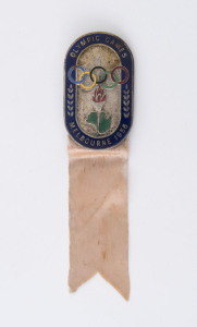 1956 MELBOURNE - OFFICIAL'S PIN BADGE: in oxidised silver with blue enamelled border and emamelled olympic rings, torch and map of Australia, ribbon intact, stamped '3205' on reverse, made by K.C. Luke (Melbourne), 51x30mm, weight 20gr. Issued to sports a