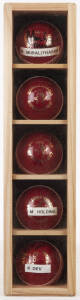 SIGNED CRICKET BALLS, in display case 10x42cm, noted Muttiah Muralitharan, Shane Warne, Courtney Walsh, Michael Holding & Kapil Dev.