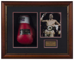 ANTHONY MUNDINE - "THE MAN": Display featuring signed boxing glove alongside victorious image of him proudly wearing his Australian National Boxing Federation belt; framed & glazed, overall 58.5 x 69.5cm, depth 15cm.