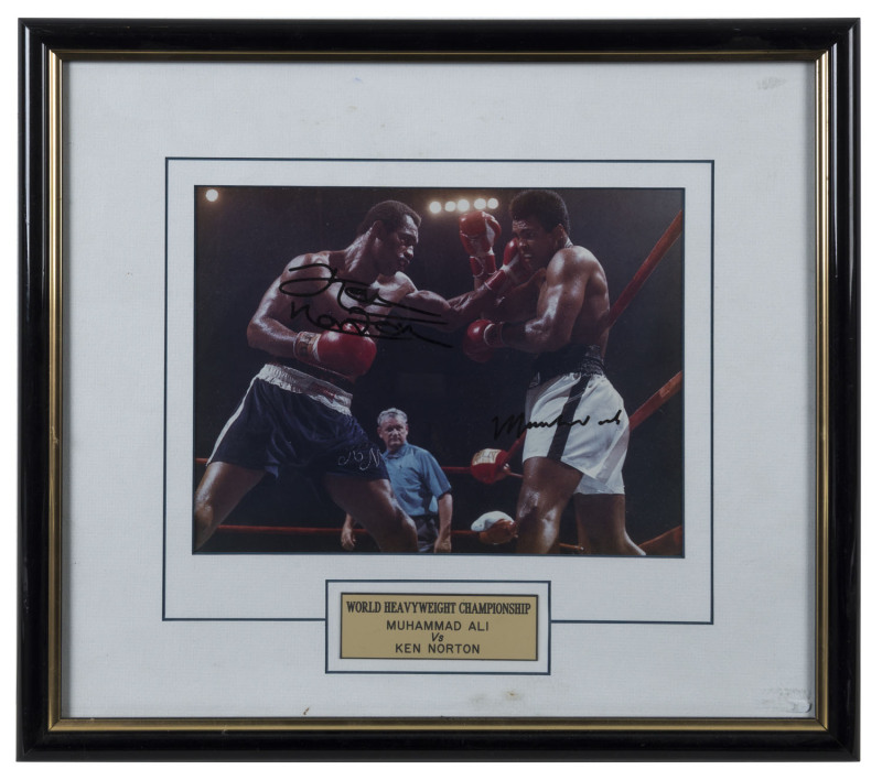 MUHAMMAD ALI v KEN NORTON, both signatures on action photograph, window mounted, framed & glazed, overall 43x39cm.