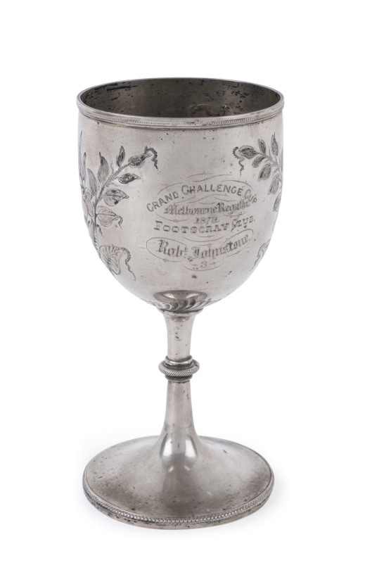 MELBOURNE REGATTA "Grand Challenge Cup, 1879, Footscray Club" 3rd place awarded to Robert Johnstone, the reverse engraved with a fine rowing scene, silver plate,17cm high.