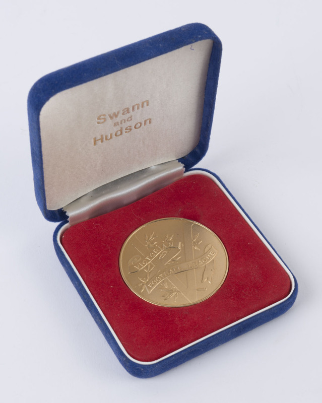 c.1960 Victorian Football League gilt medal, unengraved on reverse, 50mm diameter, weight 55.20gr, in original Swann and Hudson presentation case. 