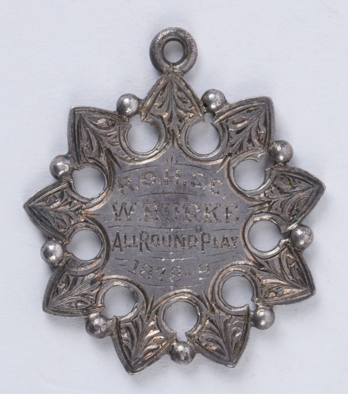 1878-79 Royal Oak Hotel Cricket Club medal awarded to W.Burke  for "All Round Play"; crossed bat and wicket on reverse.