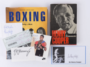 LITERATURE - WITH BOXER AUTOGRAPHS: comprising "Boxing - Unseen Archives, Photographs by Daily Mail" (Paragon, 2002) with signatures of boxers Max Schmeling (on piece), Archie Moore (on bank cheque), Henry Cooper (on piece) & Frank Bruno (on colour photograph) paperclipped to the relevant pages of the book; also Henry Cooper "An Autobiography" with signature on illustrated (Cooper flooring Muhammad Ali) commemorative envelope. (2 items)