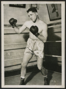 c.1940 monochrome press photograph of VIC PATRICK shadow boxing, 16.5 x 12cm. [Vic Patrick was an oyster farmer who took up boxing in 1940 to earn extra money. He won his first 18 bouts, 17 by knockout, going on to capture the Australian lighweight title