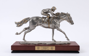 Racehorse and jockey statue in pewter, embellished with gold paint, by Royal Selangor, inscribed on base "R.Cameron by Royal Selangor pewter", Victoria Racing Club plaque on the wooden base inscribed "See Australia Sprint/Flemington/5th November 2002", overall length 34.5cm, width 10cm, height 24cm, weight 2.98kg.