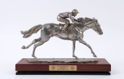 Racehorse and jockey statue in pewter, embellished with gold paint, by Royal Selangor, inscribed on base "R.Cameron by Royal Selangor pewter", Victoria Racing Club plaque on the wooden base inscribed "See Australia Sprint/Flemington/5th November 2002", o