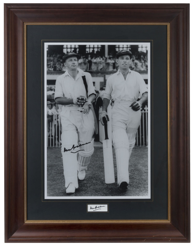 DON BRADMAN: inset autograph on piece beneath large image (73 x48cm) of Bradman & Jack Fingleton walking out to bat in the 2nd Innings of the 3rd Ashes Test at the MCG in January 1937; with CofA; attractively framed and glazed, overall 115 x 87cm.