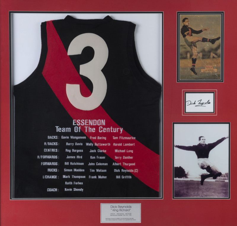 DICK REYNOLDS "KING RICHARD" - ESSENDON: Impressive display featuring Essendon No 3 jersey embroidered with Essendon's "Team of the Century", captained by Reynolds, with window mounted reproduction images of a c.1950 'Sporting Life' poster of Reynolds and