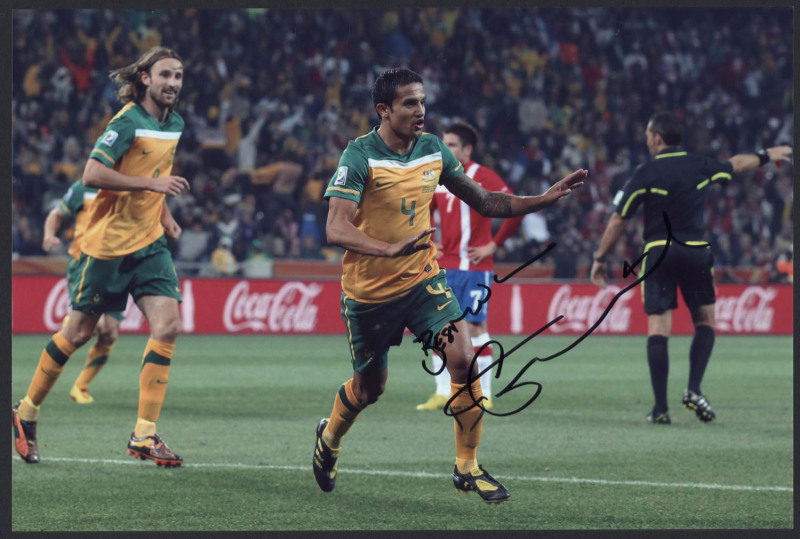 TIM CAHILL: glossy colour photograph of Cahill playing for Australia (20 x 30cm), SIGNED BY CAHILL, with CofA (2011).